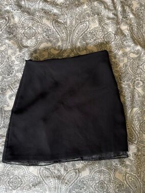 Mini black skirt with sheer lining